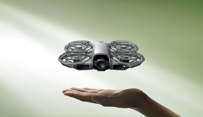 DJI Neo 2 follow-me drone hovering above an open palm